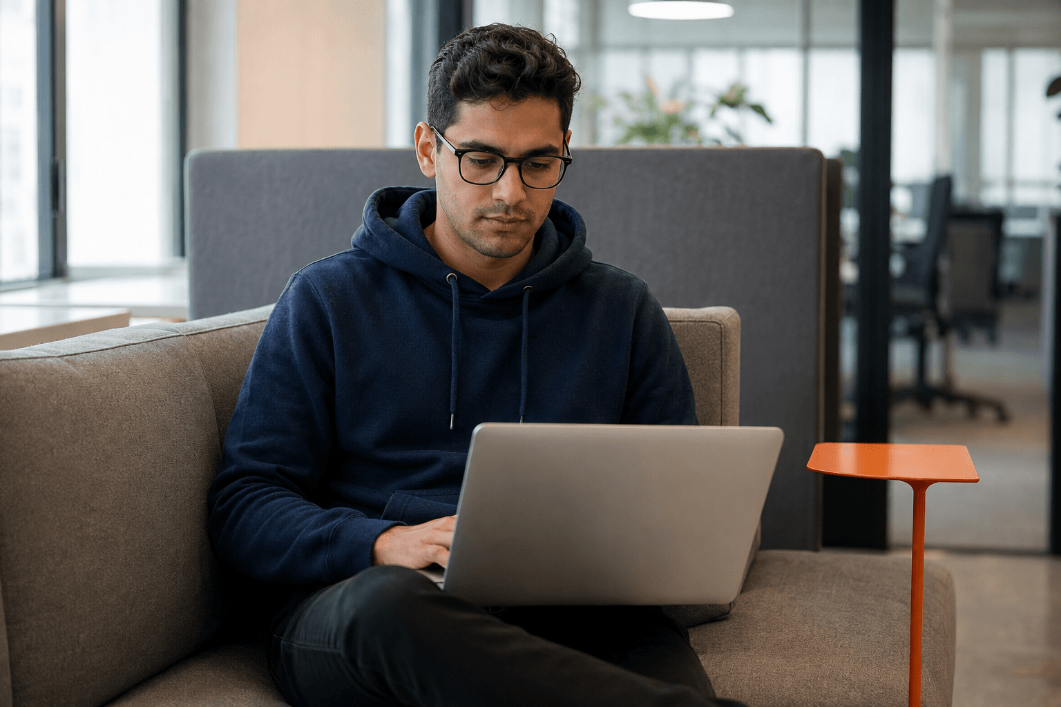 Focused software engineer working in a Lakewood office
